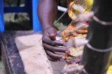 Close-up of hands skillfully playing a cavaquinho during a workshop