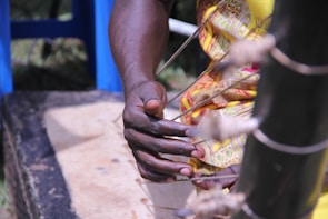 Close-up of hands playing traditional string instruments during a communal music session