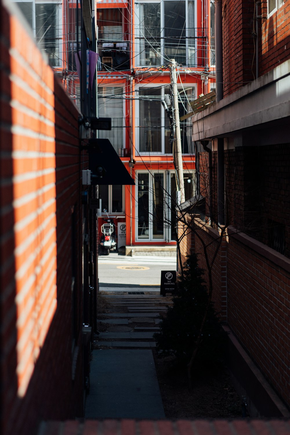 gray electric post on street during daytime