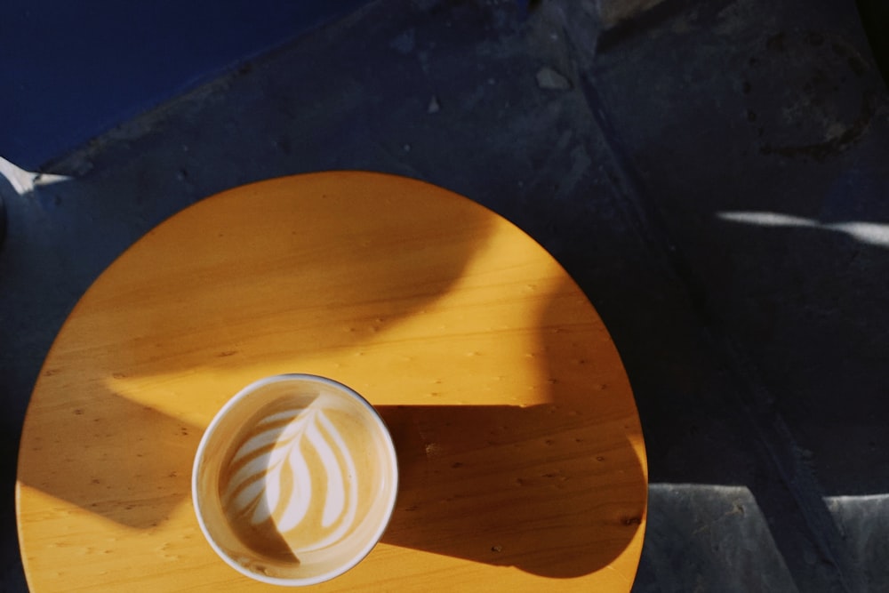 white ceramic mug filled with coffee