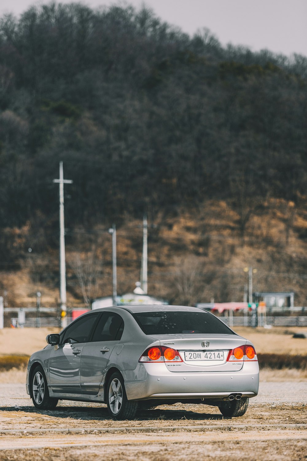 gray sedan parked outside