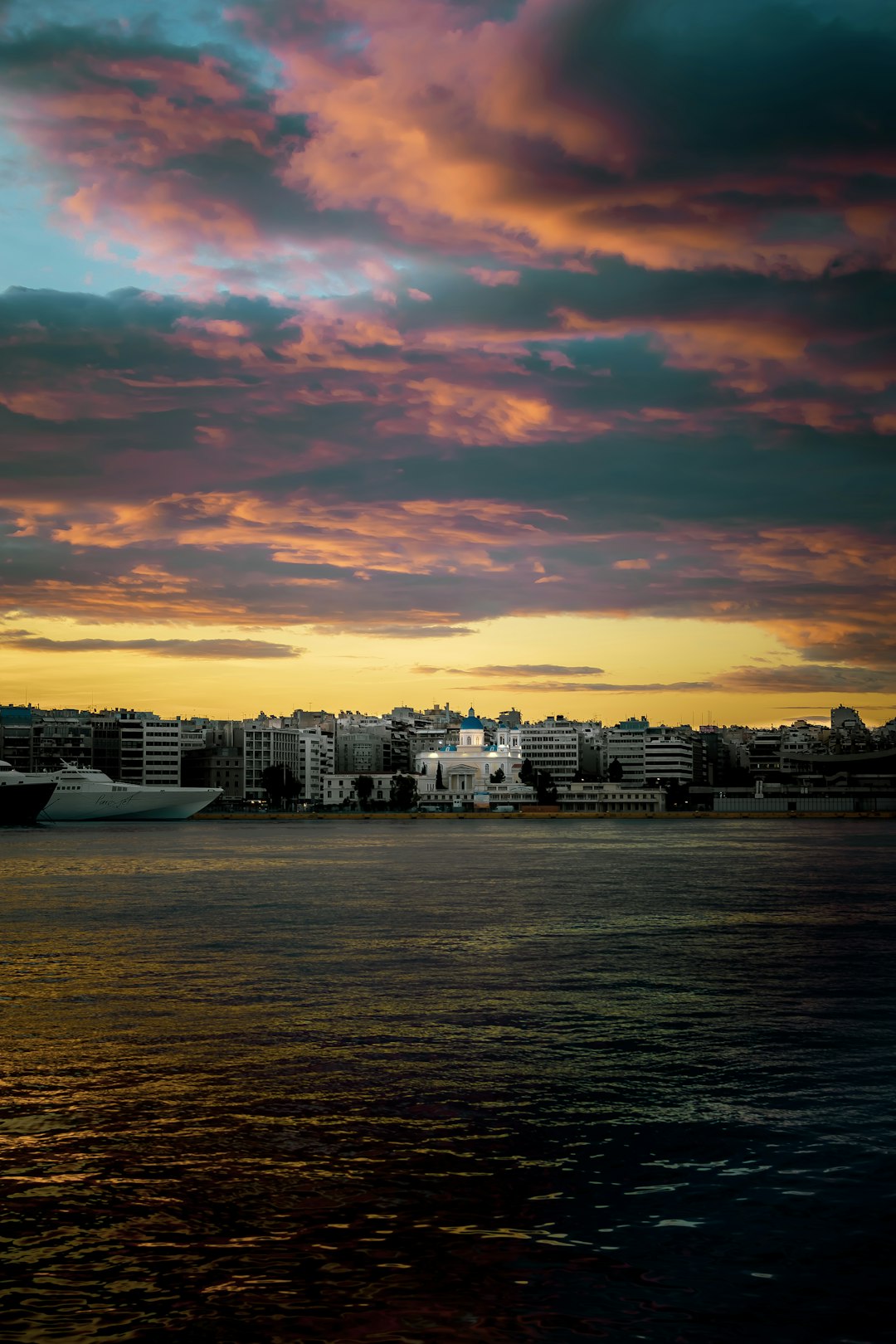 calm sea near building during golden hour