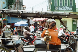 man sitting in vehicle
