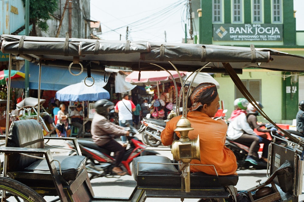 man sitting in vehicle