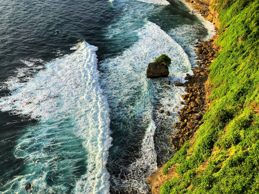 aerial view of seashore near mountain