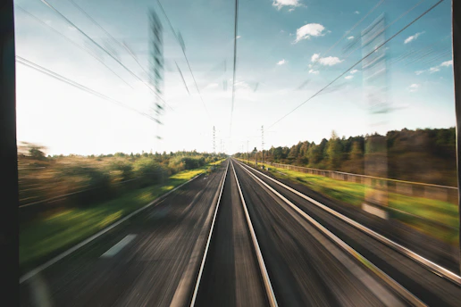 a view of a train track from a moving train