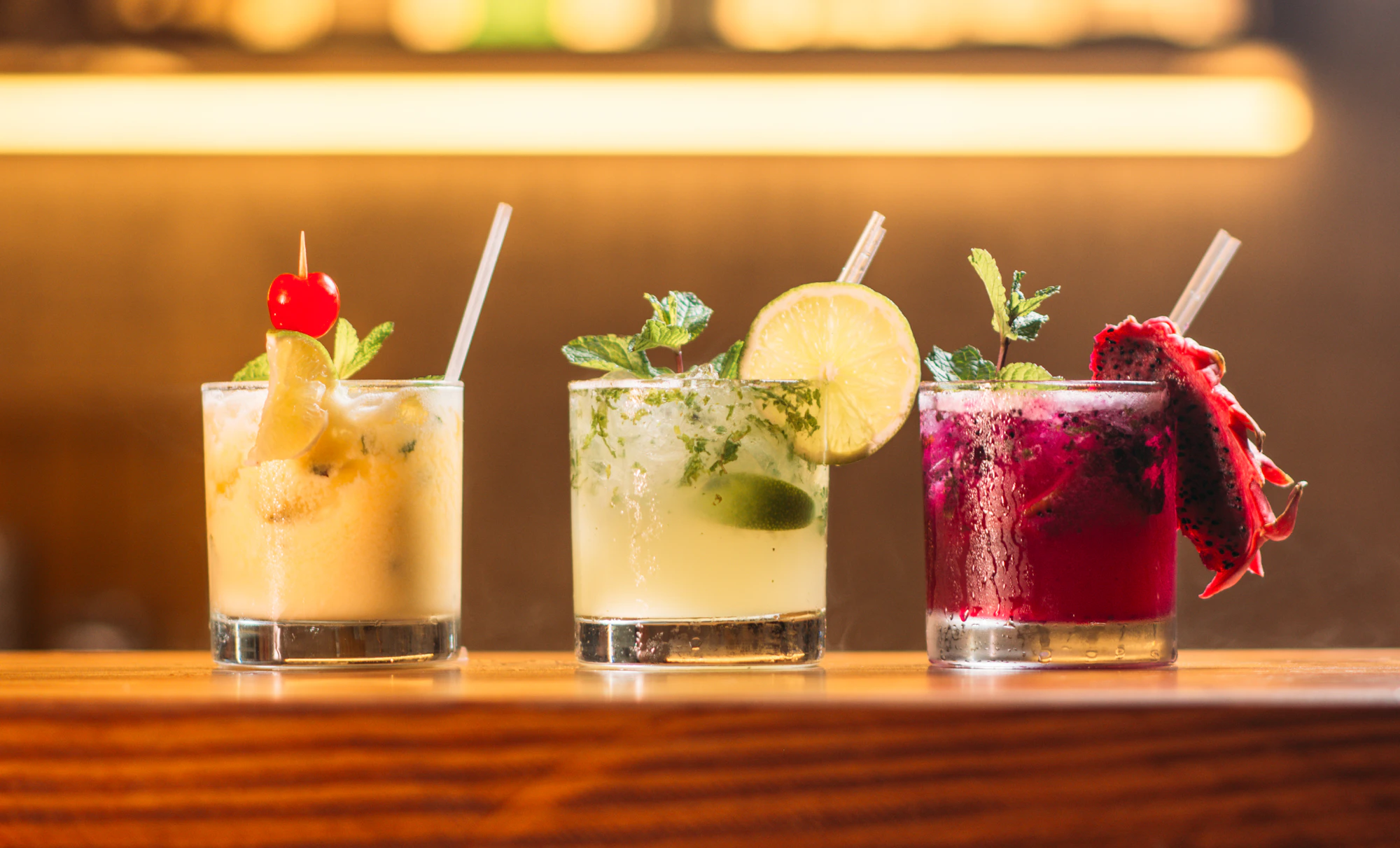 Colorful alcohol-free sparkling drinks served with fresh citrus