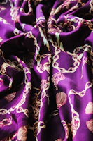 Vibrant silk fabric with intricate patterns draped elegantly