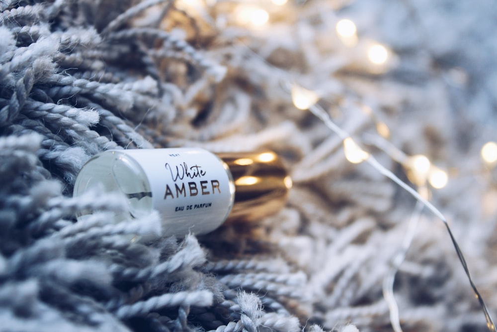 white Amber glass bottle on rug