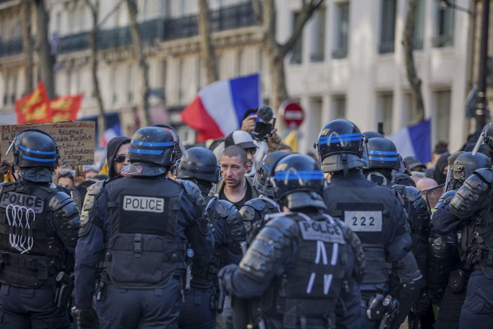 police facing people in road