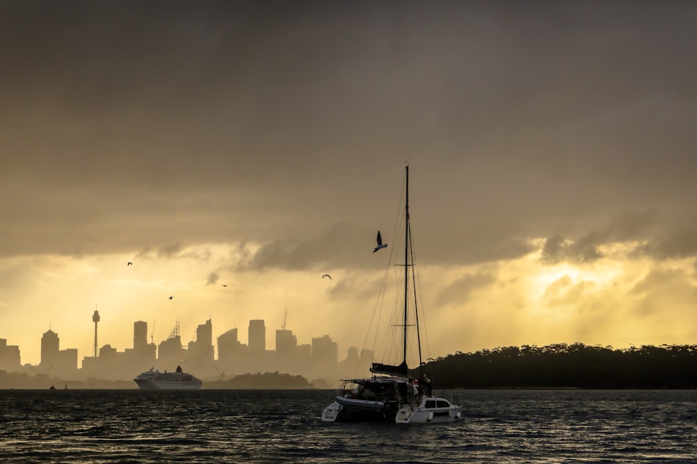 yacht moored near beach at dusk