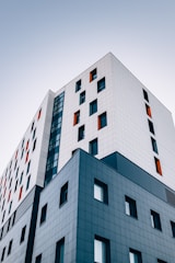 blue and white building across sky
