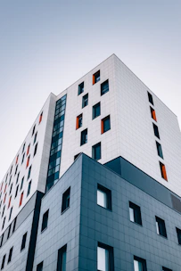 blue and white building across sky