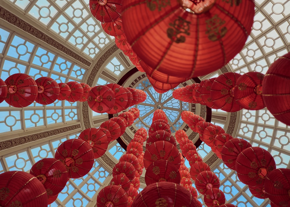 red lanterns hanging on white ceiling