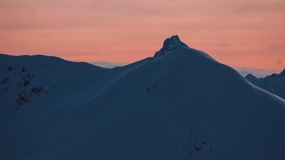 snow covered mountain during daytime