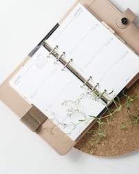 white and browm notebook