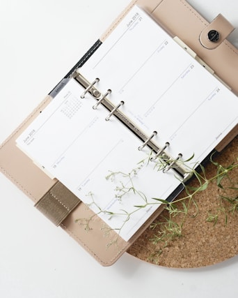 white and browm notebook