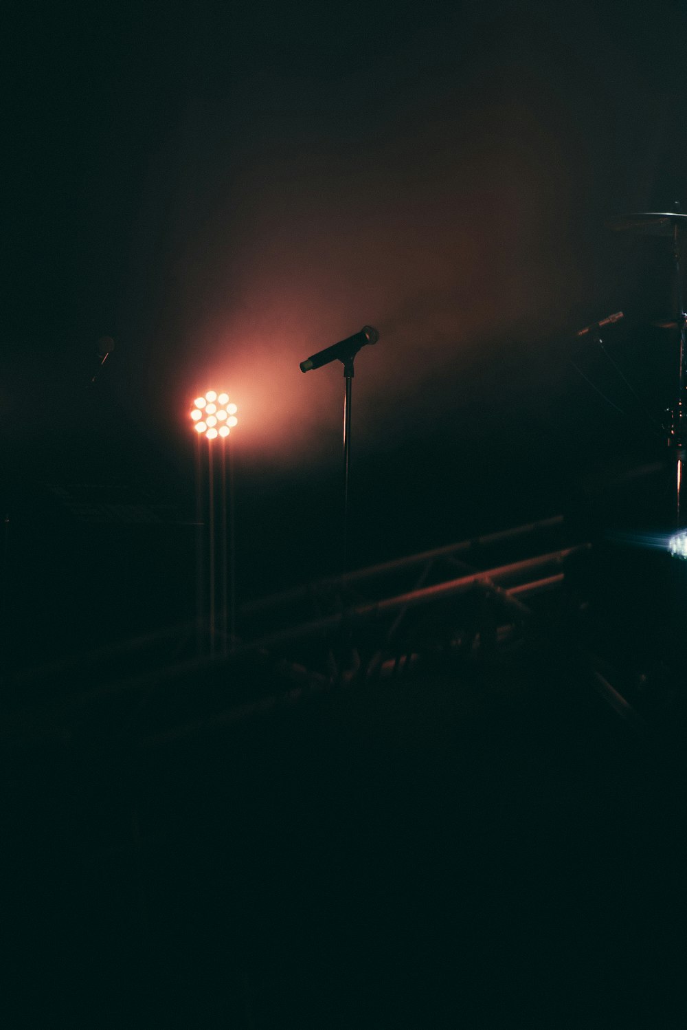 black microphone on stand across lights