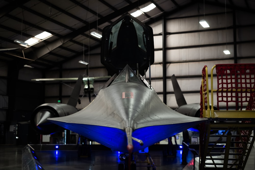 silver, black, and blue aircraft