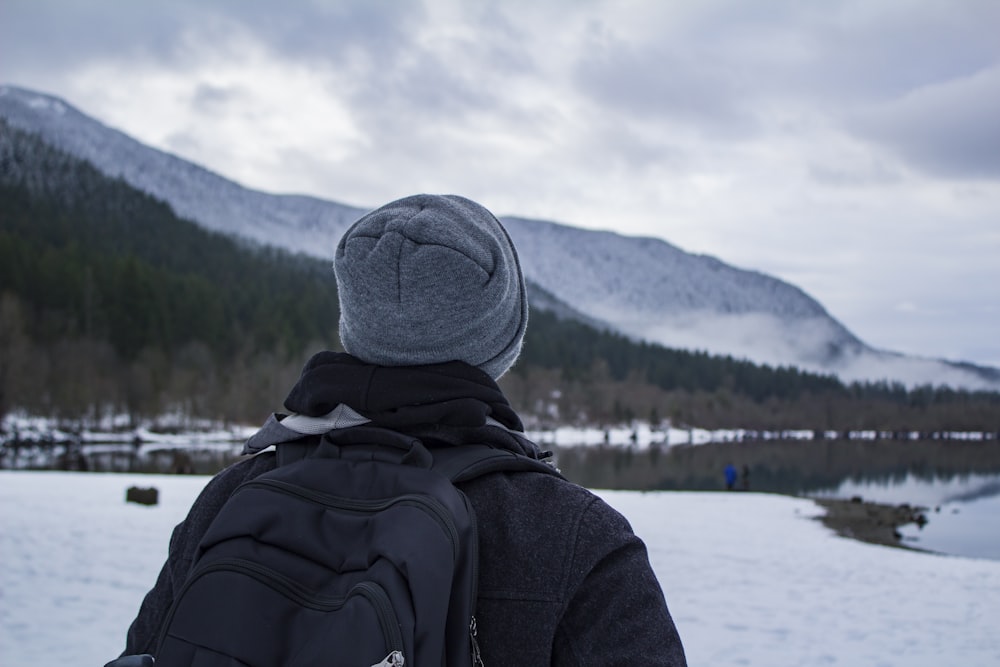 person carrying backpack