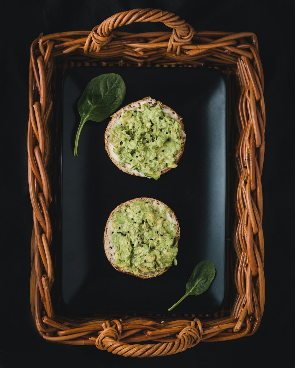 two baked cookies on brown wicker basket