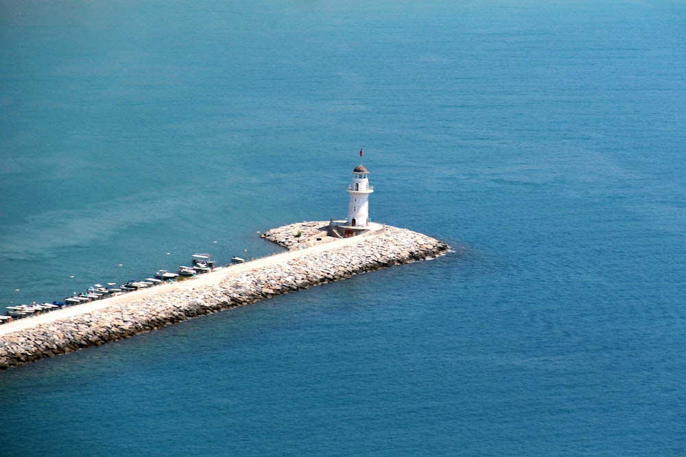 lighthouse surrounded by sea