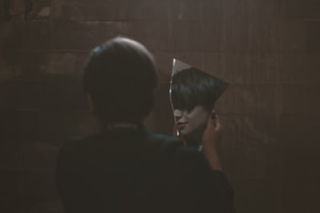 woman holding mirror