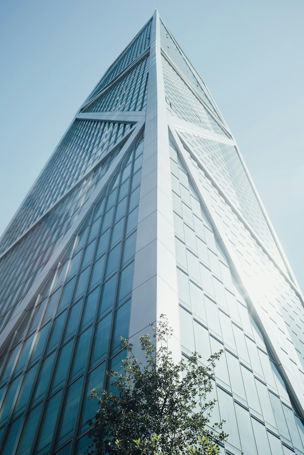 low angle photography of glass curtain building during daytime