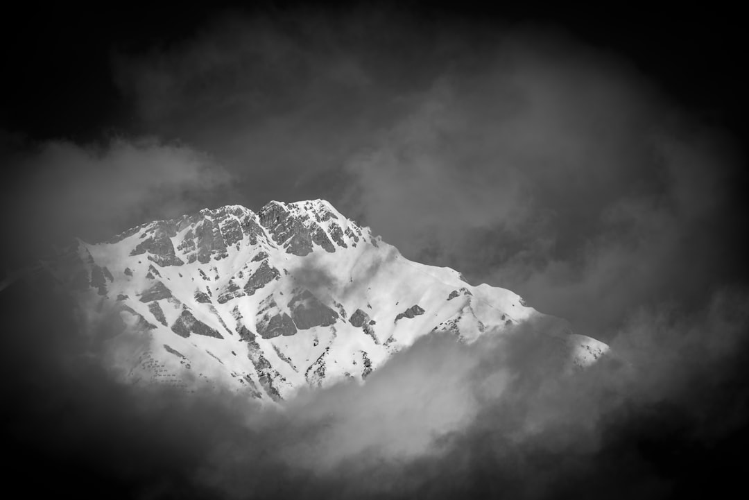 grayscale photography of snowcovered mountain