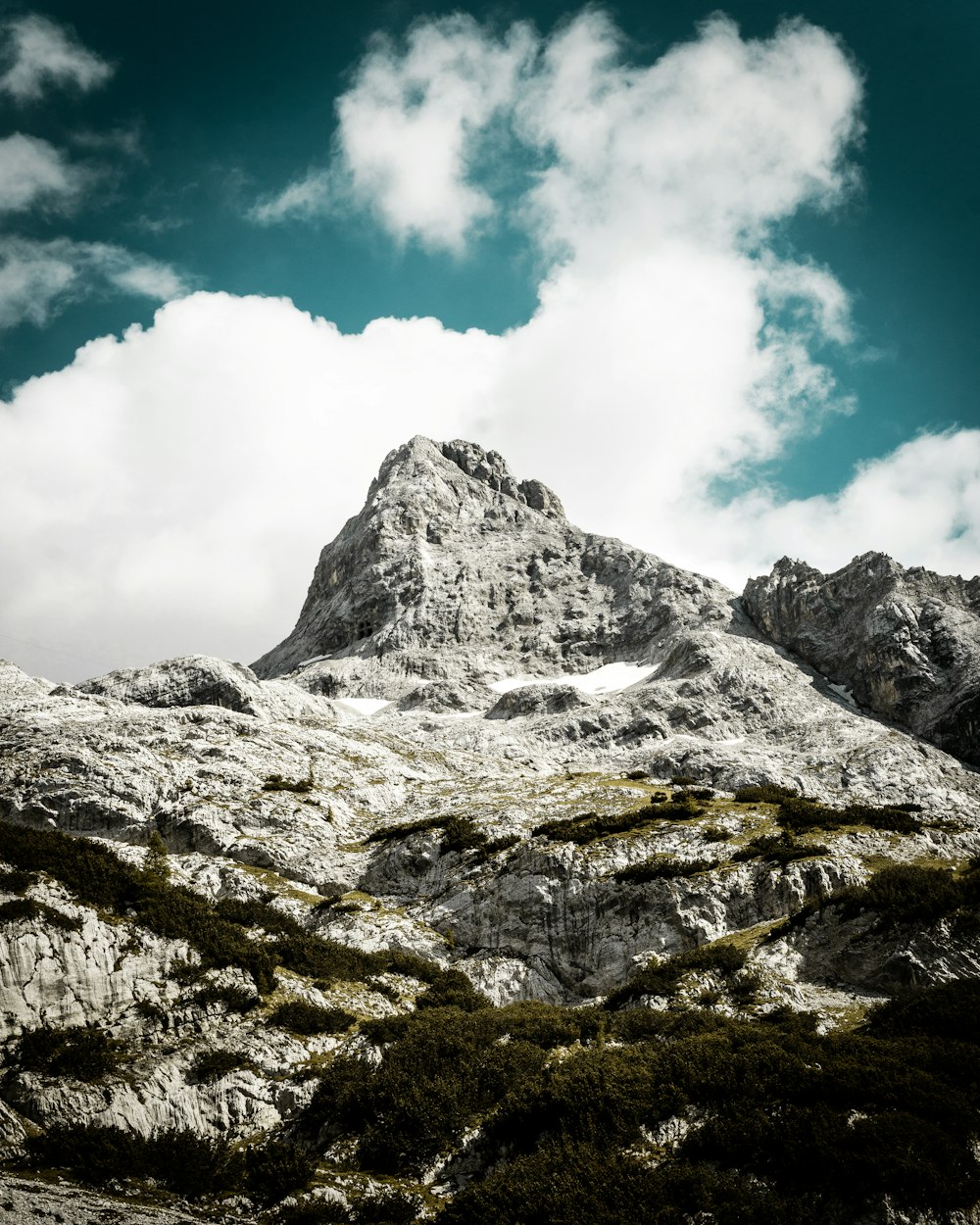 gray mountain across white cloud