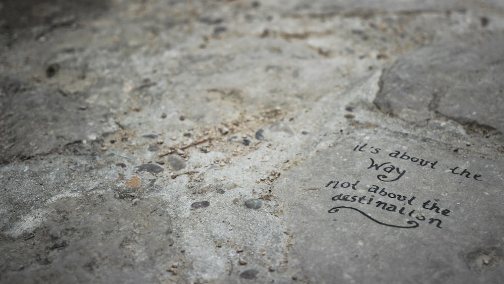 a close up of a rock with writing on it