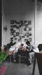 three person sitting on sofa set