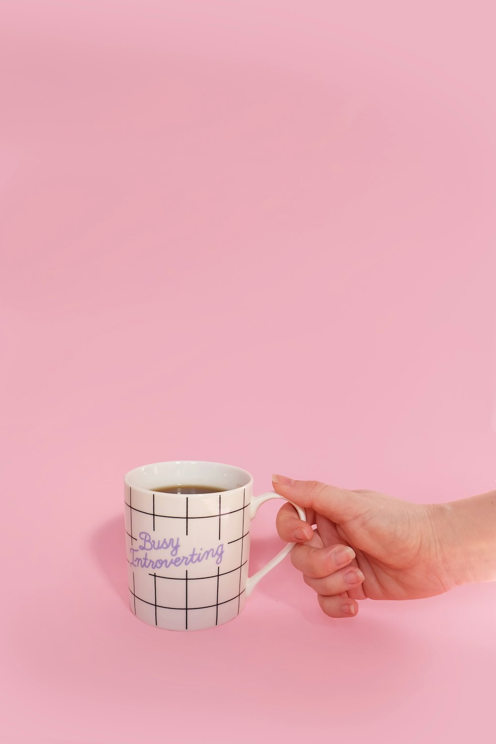 White Mug with a hand