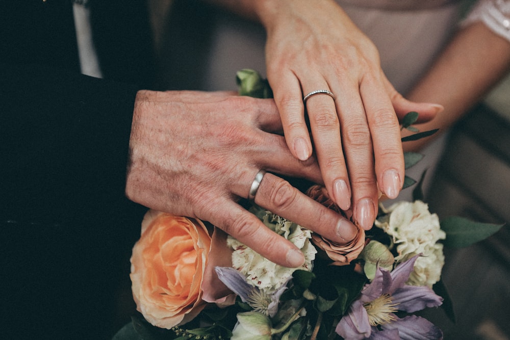two hands holding each other photo – Free Image on Unsplash