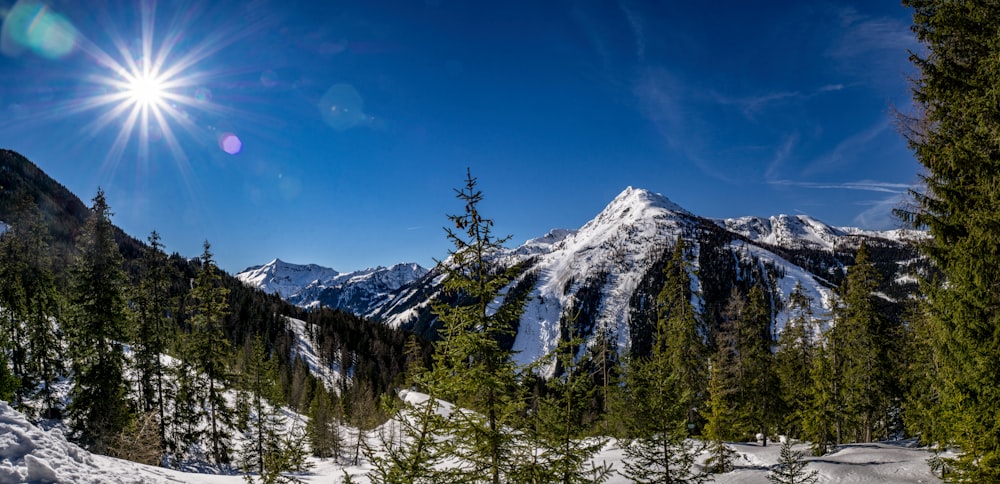 snow covered mountain under blue sky during daytime