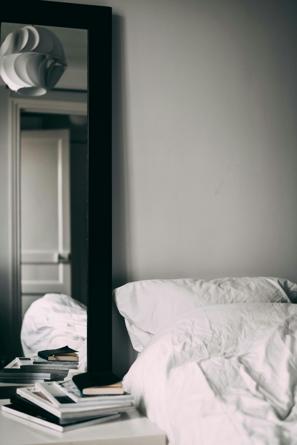 Rectangular Black Wooden Framed Mirror Inside Bedroom Photo