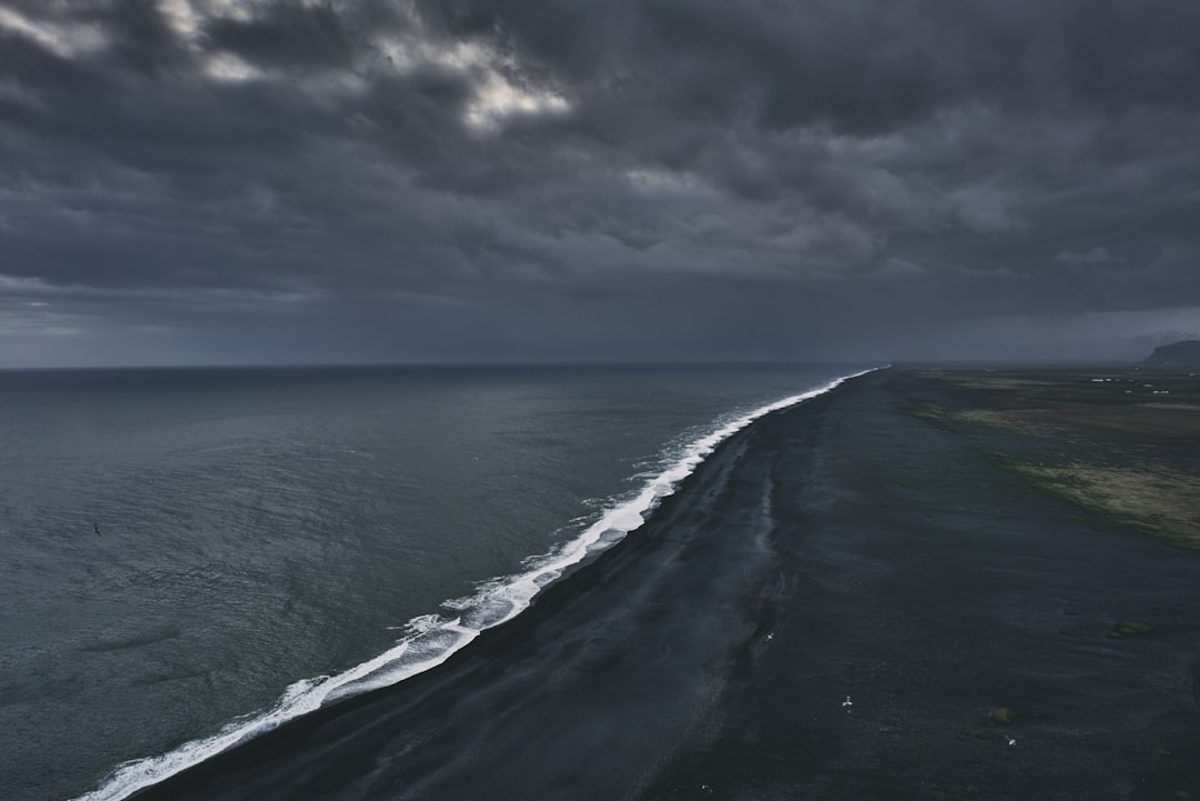 ocean under cloudy sky