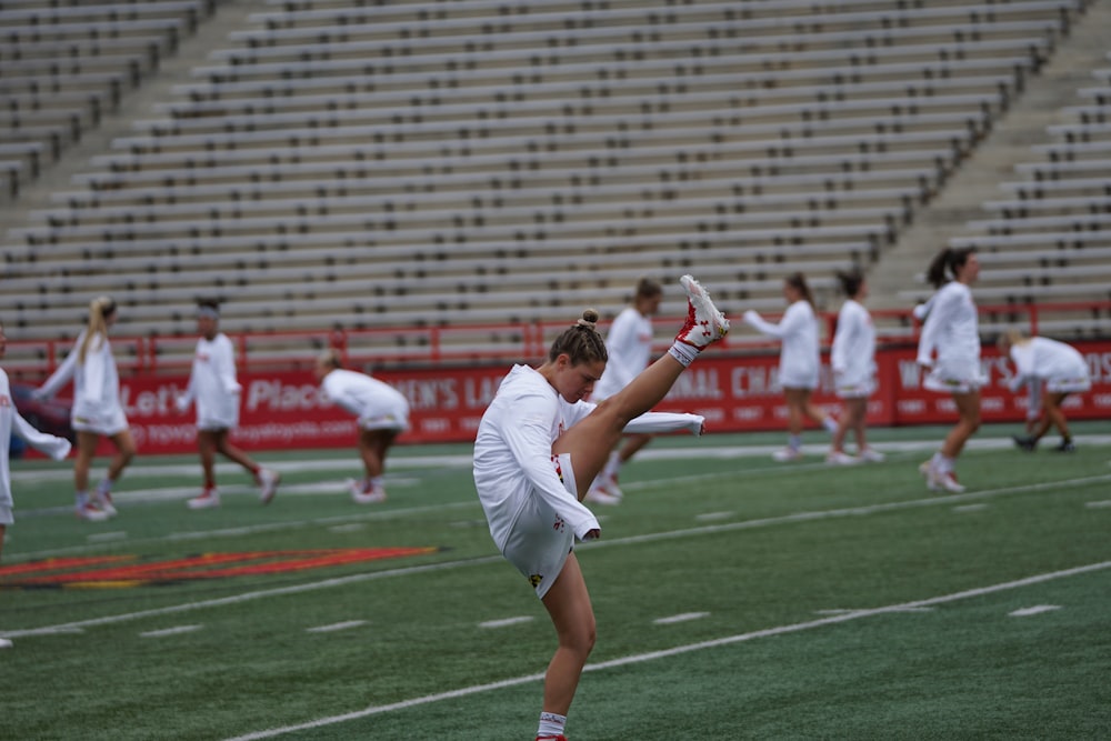 woman athlete doing exercise on field