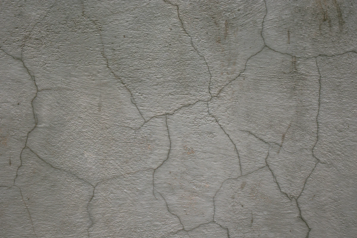 A crack running through a concrete surface, seen close up