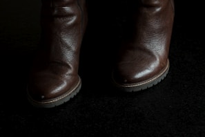 A stylish pair of leather boots from the Ponix Collection.