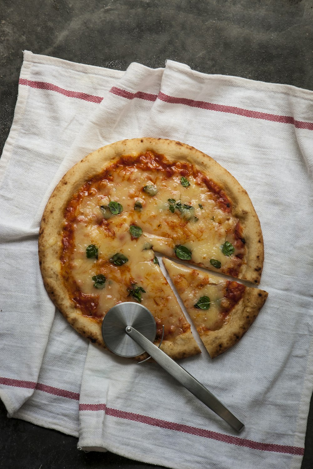 pizza on white cloth