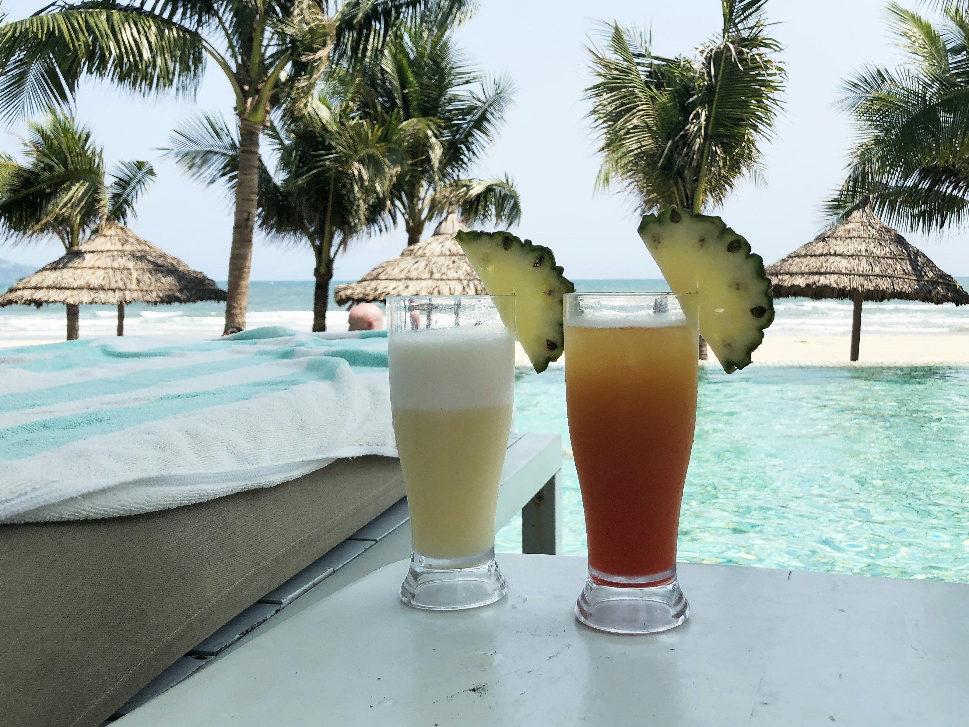 two fully filled drinking glasses on table