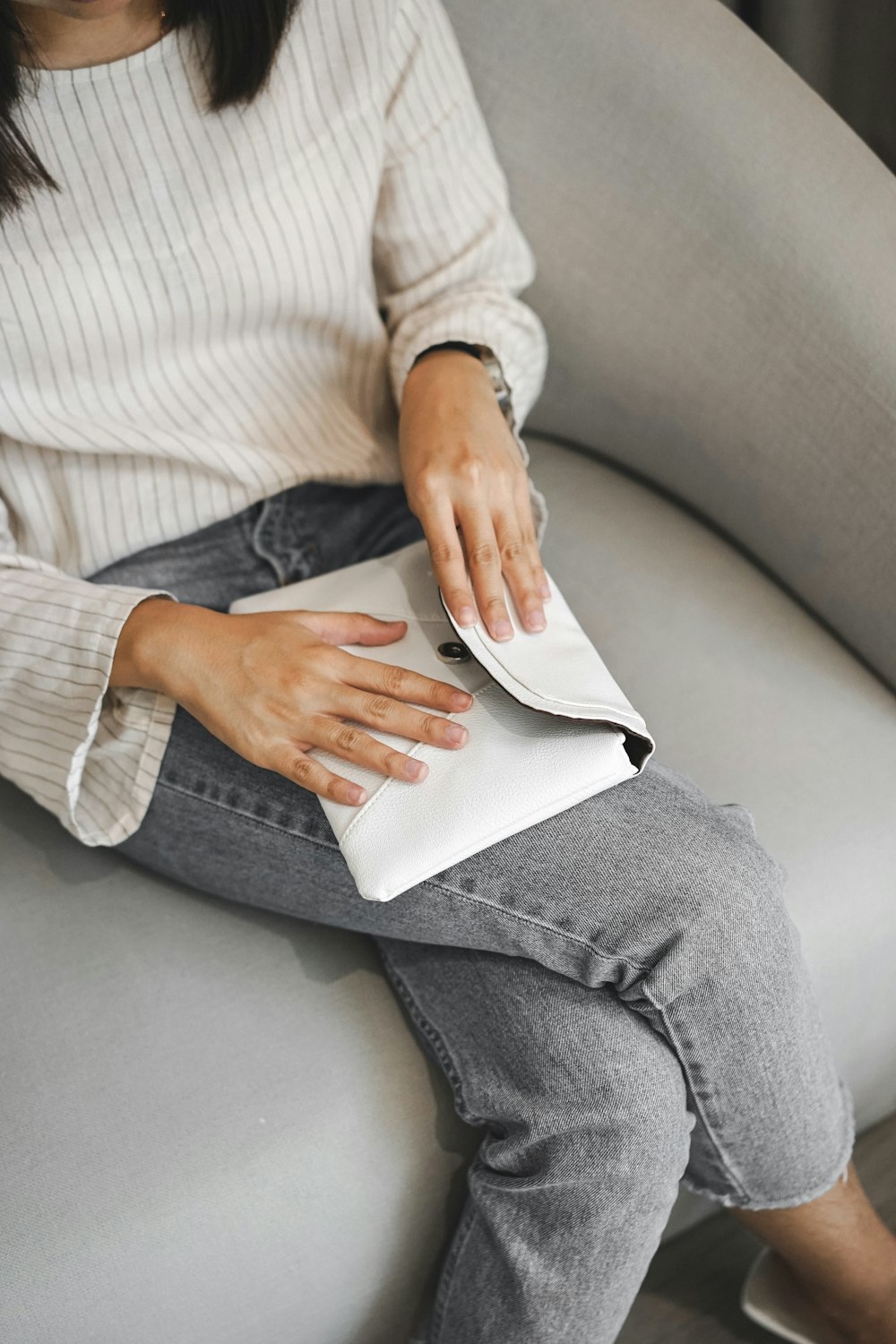 women about to close envelope clutch