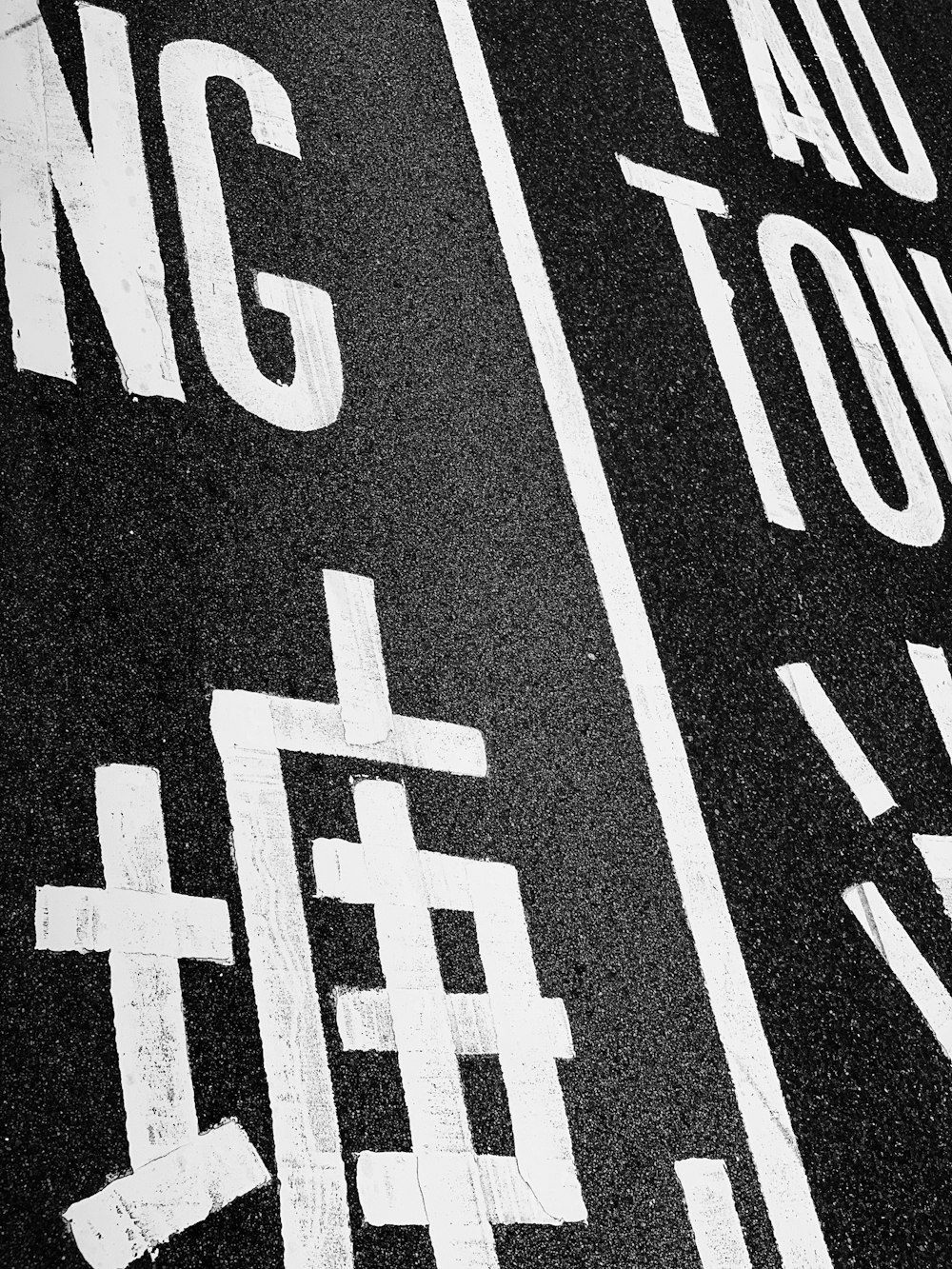 a black and white photo of a street sign