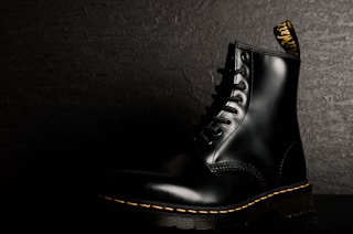 unpaired black leather boot