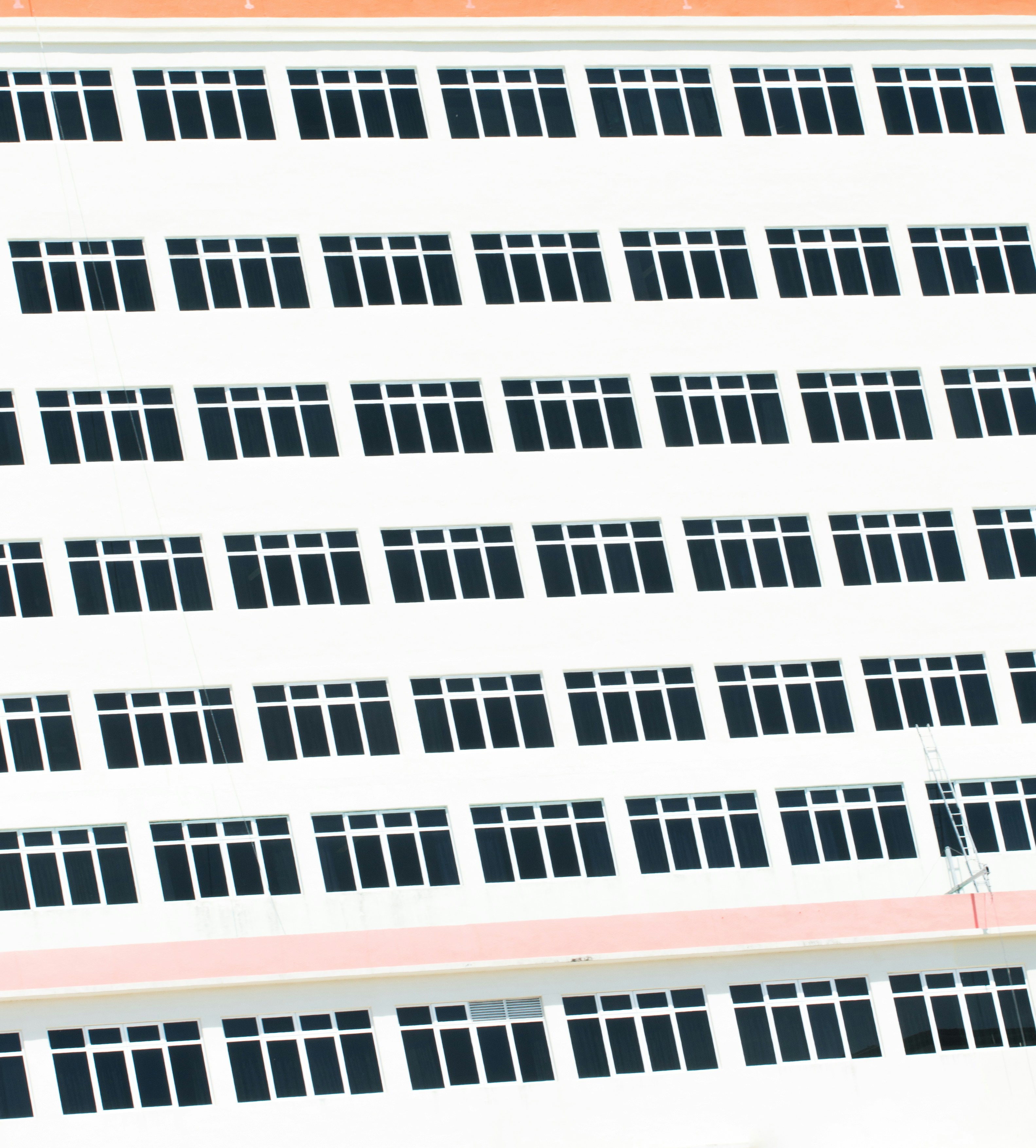 a large white building with lots of windows