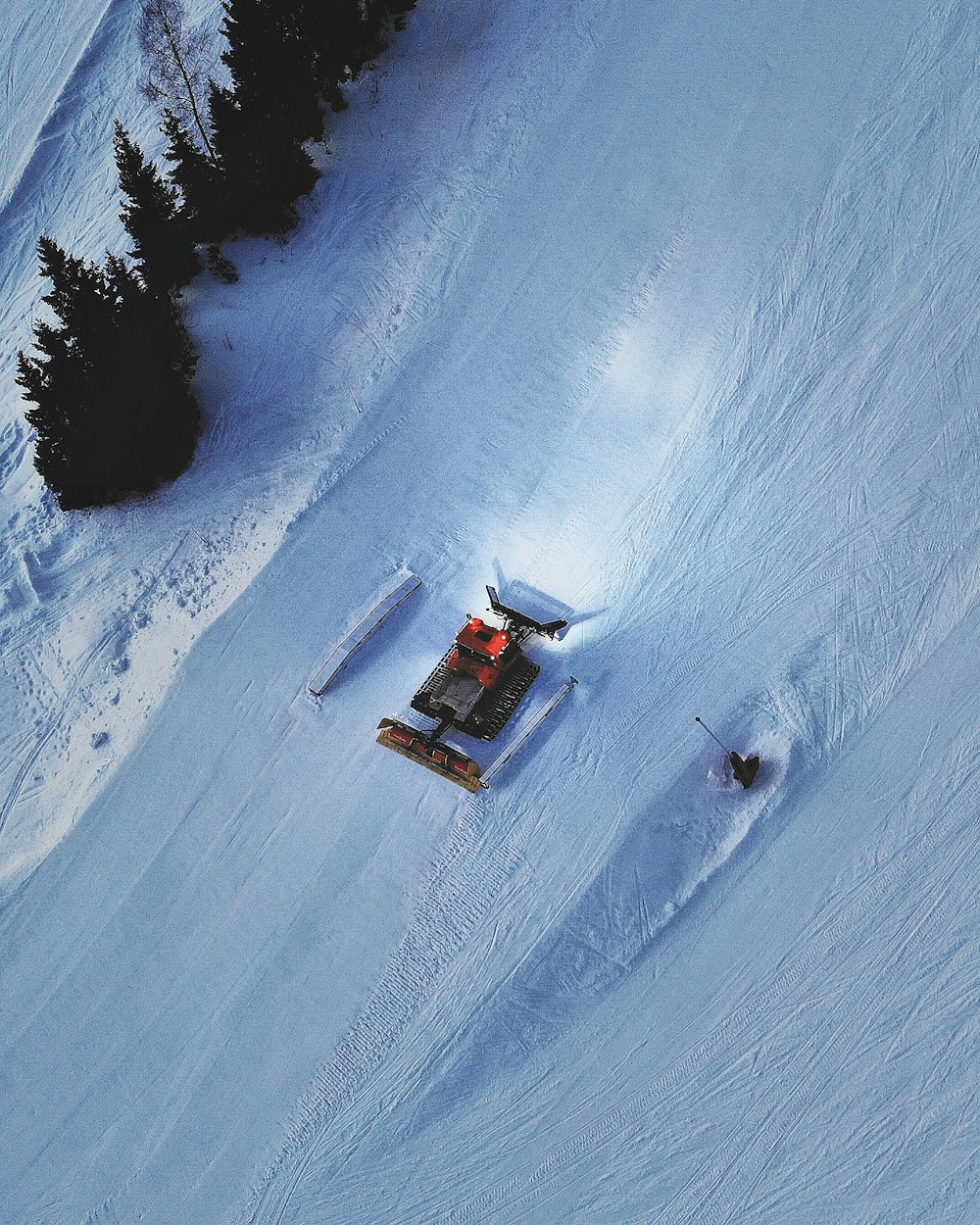 snow vehicle on snow covered field