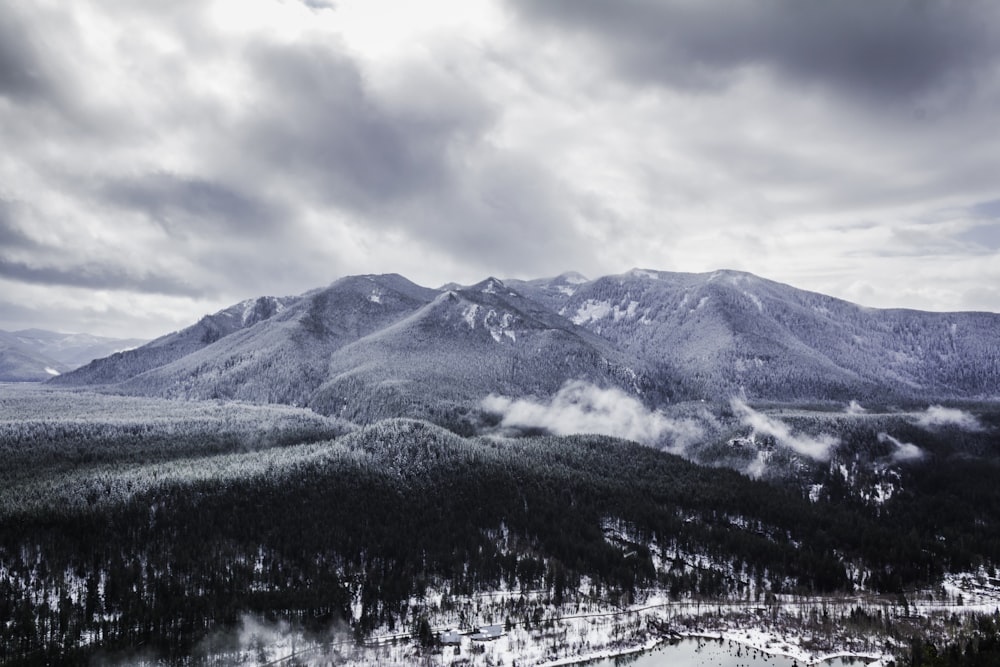 a view of a mountain range covered in snow