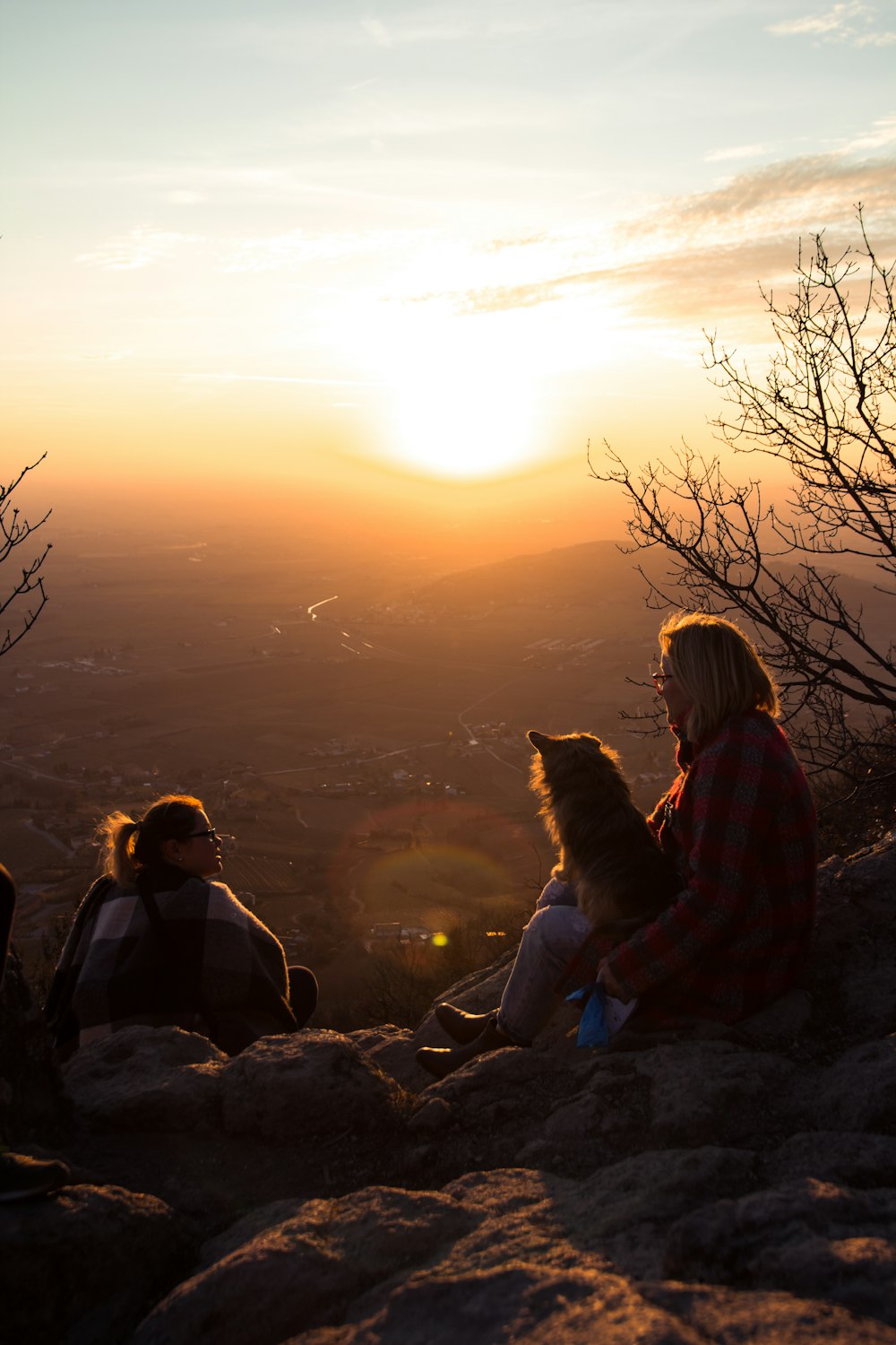 two women on hill during golden hour