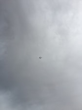 An airplane is flying through a cloudy sky with minimal visibility.
